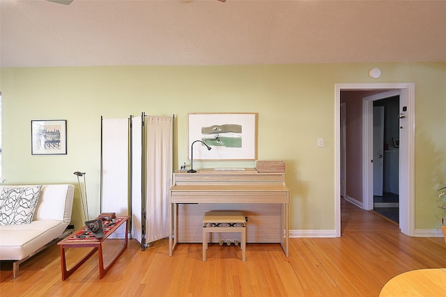 sitting room featuring wood finished floors and baseboards