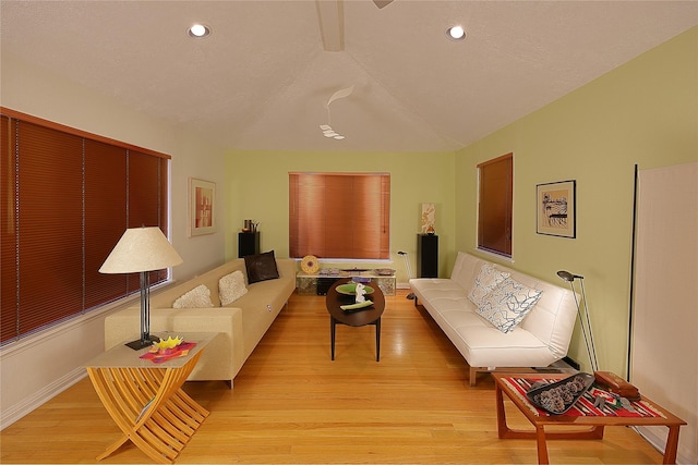 living area featuring baseboards, recessed lighting, and light wood-style floors