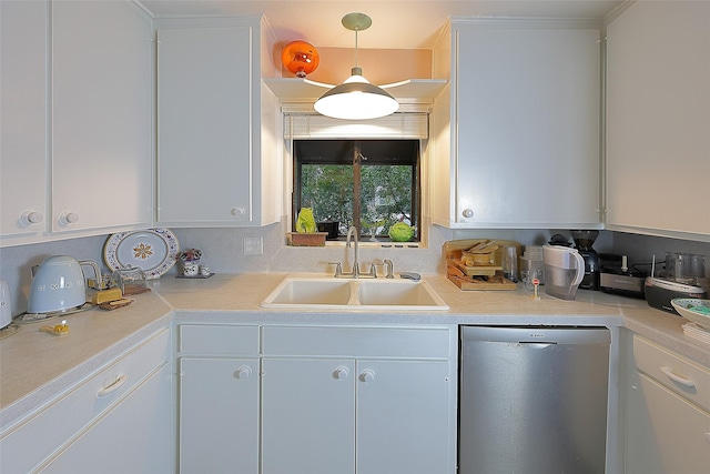 kitchen with dishwasher, decorative light fixtures, light countertops, white cabinetry, and a sink