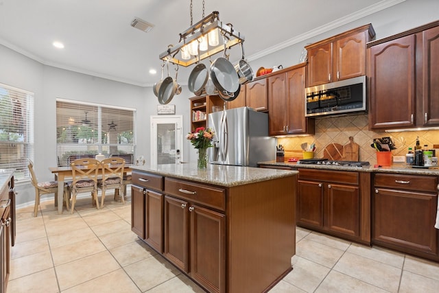 kitchen featuring ornamental molding, appliances with stainless steel finishes, visible vents, and light tile patterned floors