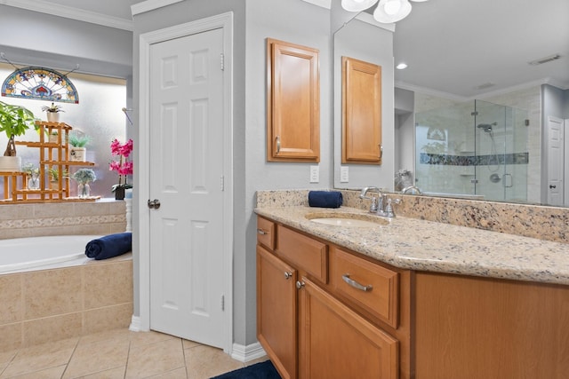 full bath featuring tile patterned floors, a shower stall, crown molding, a garden tub, and vanity
