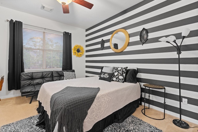 bedroom with baseboards, visible vents, carpet floors, and ceiling fan