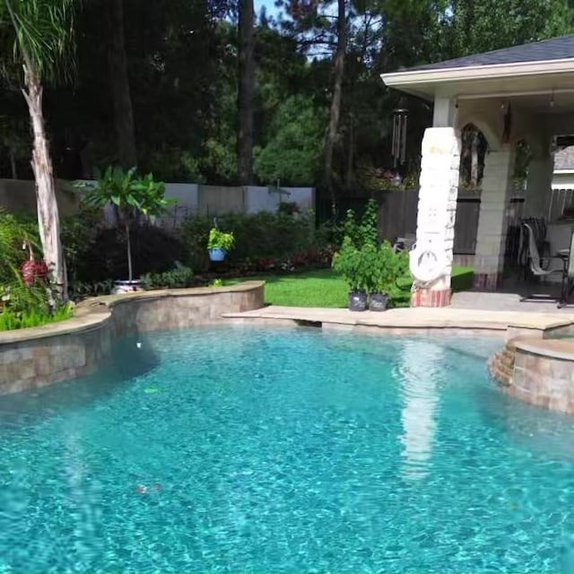 view of pool featuring a fenced backyard and a fenced in pool