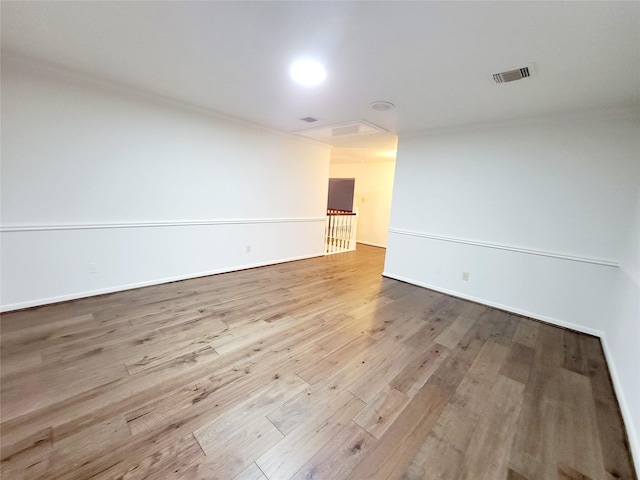 spare room featuring light hardwood / wood-style floors