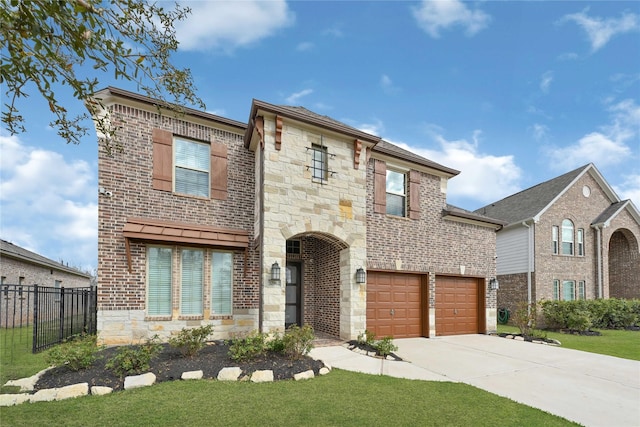 view of front of property with brick siding, fence, concrete driveway, a garage, and stone siding