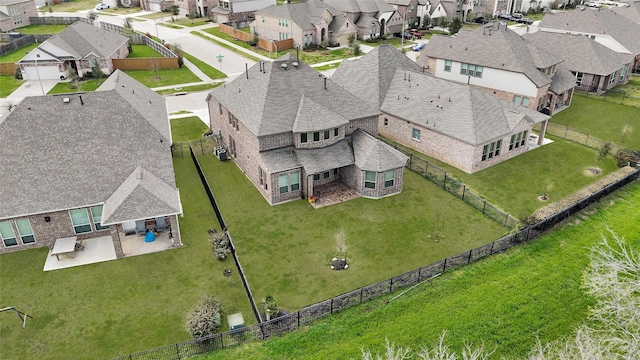 birds eye view of property with a residential view