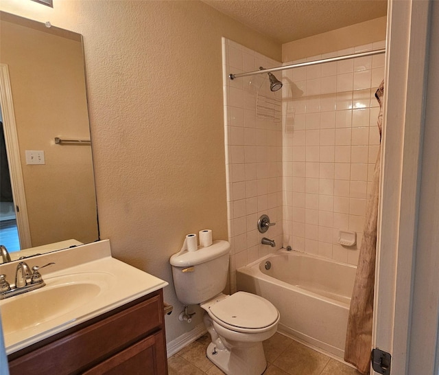 full bathroom with a textured ceiling, toilet, vanity, tile patterned floors, and shower / bath combo