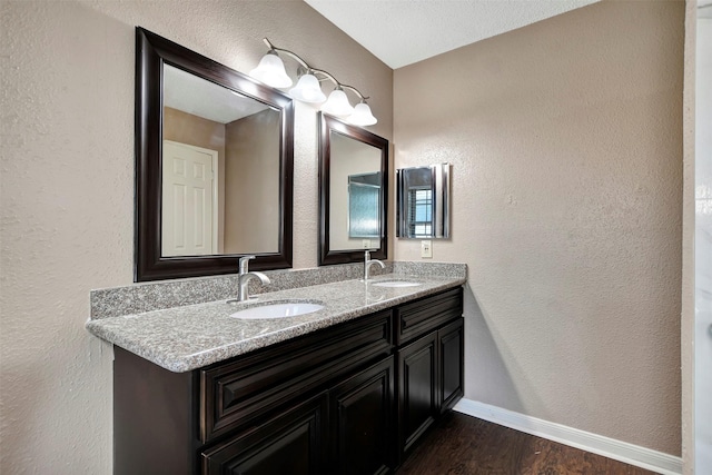 bathroom featuring vanity and hardwood / wood-style floors