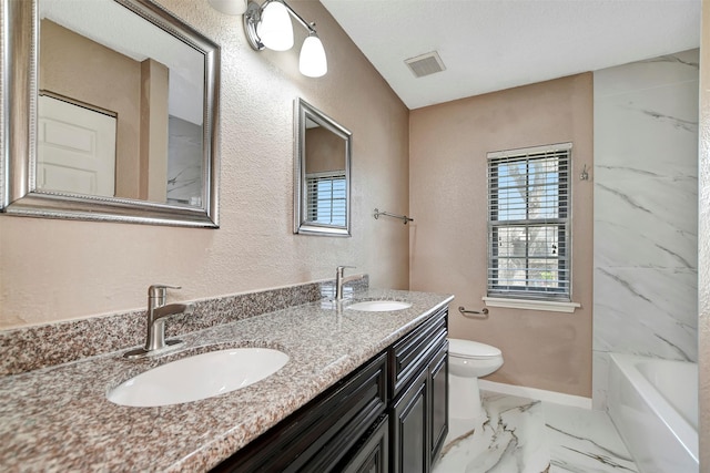 full bathroom featuring vanity, tub / shower combination, and toilet