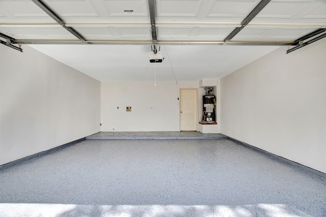 garage with a garage door opener and water heater