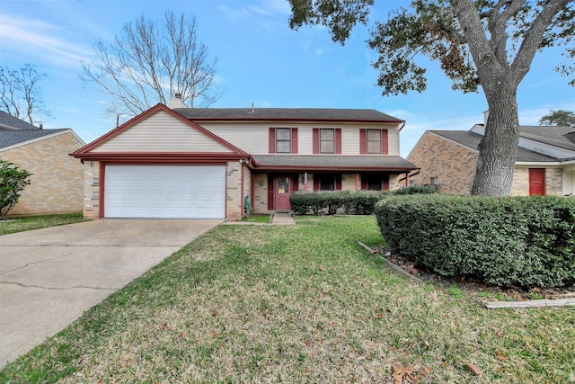 view of property with a garage and a front lawn