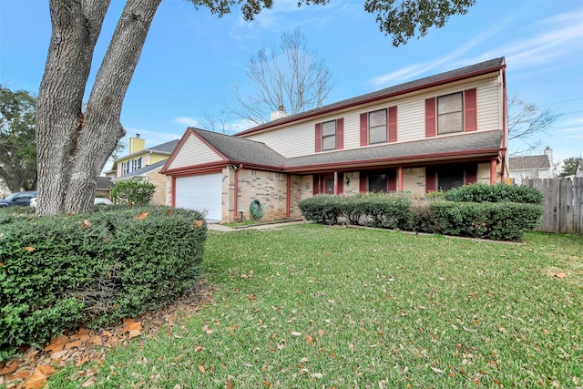 view of front of home featuring a garage and a front yard