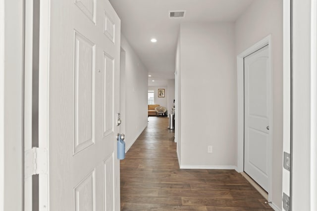 hallway featuring dark wood-type flooring