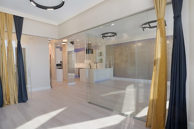 bathroom with sink and wood-type flooring