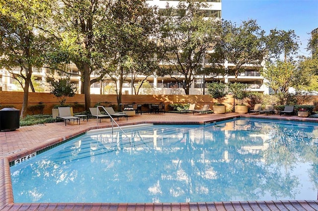 view of pool featuring a patio