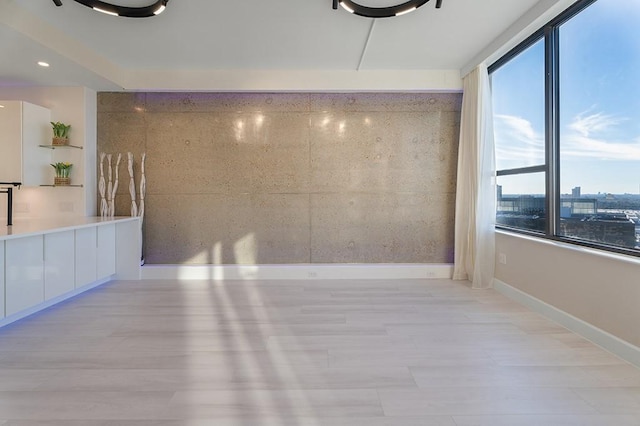 spare room featuring light hardwood / wood-style flooring