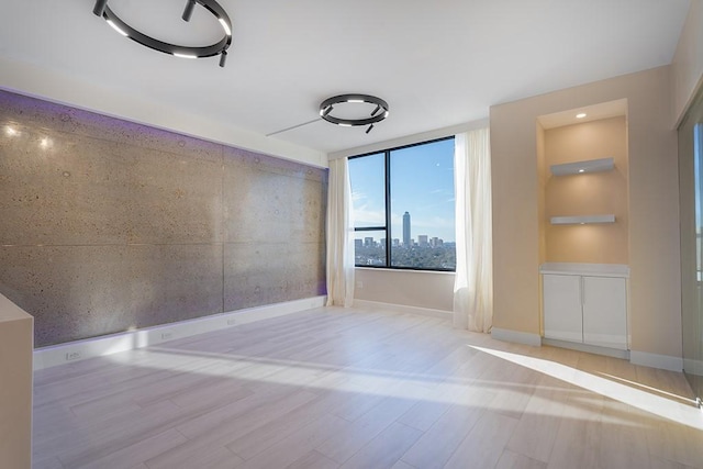 empty room featuring light hardwood / wood-style floors