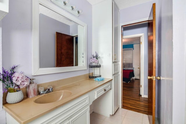 bathroom featuring tile patterned floors and vanity