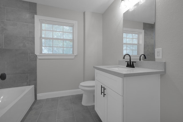 full bath with toilet, vanity, a tub, baseboards, and tile patterned floors