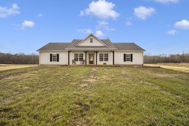 view of front of home featuring covered porch and a front lawn