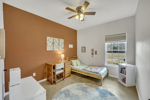 bedroom featuring ceiling fan and light carpet