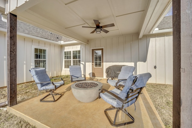 view of patio / terrace featuring ceiling fan and a fire pit