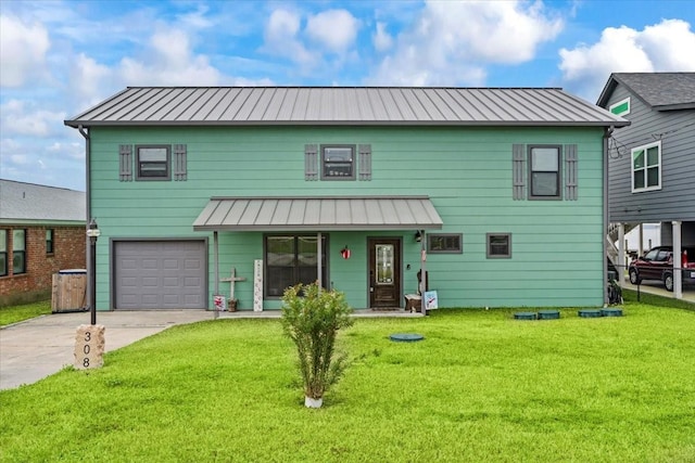 308 Lakeshore S, Onalaska, TX 77360 - view of front of home with a garage, metal roof, a front yard, driveway, and a standing seam roof