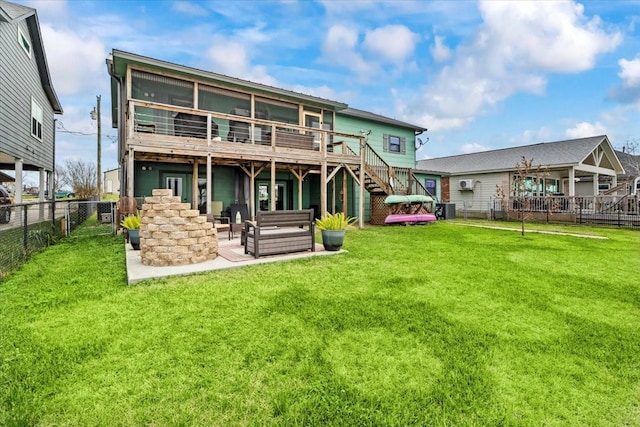 308 Lakeshore S, Onalaska, TX 77360 - back of house featuring a lawn, a patio, stairs, a wooden deck, and a fenced backyard