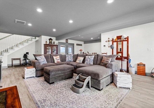 308 Lakeshore S, Onalaska, TX 77360 - living room with stairs, recessed lighting, visible vents, and wood finished floors