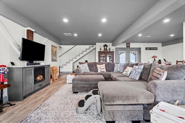 308 Lakeshore S, Onalaska, TX 77360 - living area with recessed lighting, light wood-type flooring, a fireplace, and stairs