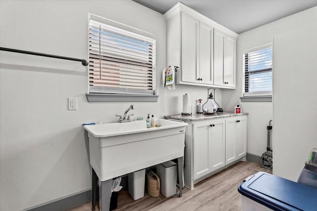308 Lakeshore S, Onalaska, TX 77360 - clothes washing area featuring light wood-type flooring and baseboards