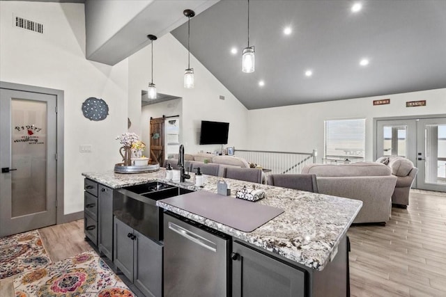 308 Lakeshore S, Onalaska, TX 77360 - kitchen with open floor plan, high vaulted ceiling, visible vents, and dishwasher
