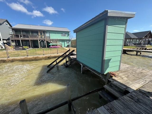 308 Lakeshore S, Onalaska, TX 77360 - exterior space featuring a water view, stairway, and fence