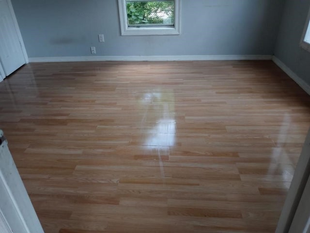 unfurnished room featuring light hardwood / wood-style floors