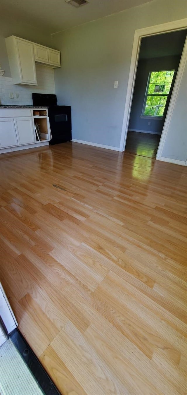 unfurnished living room featuring light hardwood / wood-style flooring