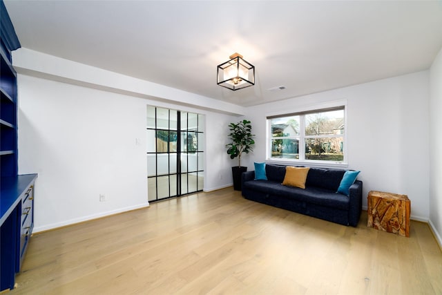 sitting room featuring a wealth of natural light and light wood-type flooring