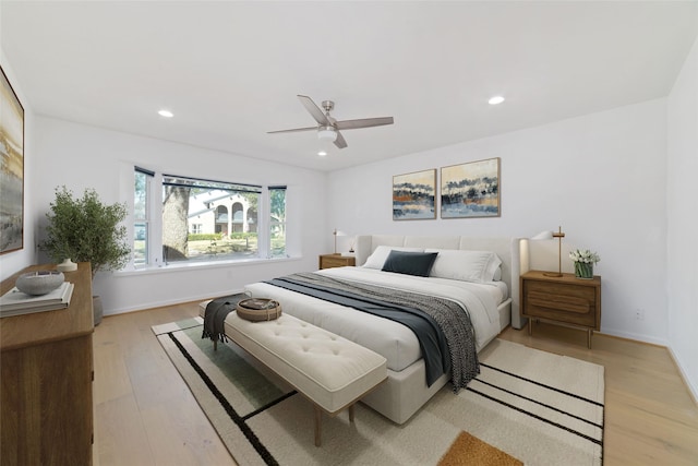 bedroom featuring ceiling fan and light wood-type flooring