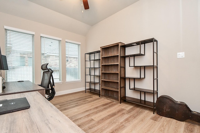 office area with vaulted ceiling, ceiling fan, and light wood-type flooring