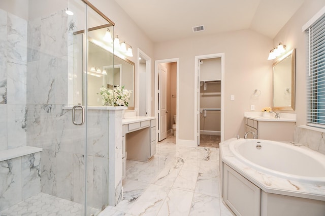 bathroom with lofted ceiling, vanity, toilet, and a shower with shower door