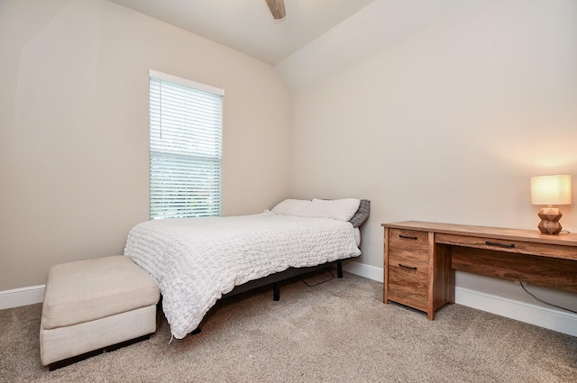 carpeted bedroom featuring ceiling fan and lofted ceiling