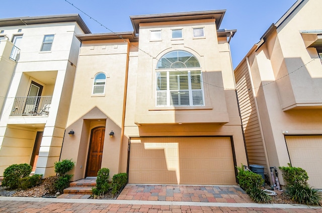 townhome / multi-family property featuring a garage