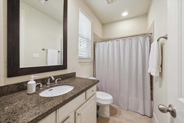 full bathroom with vanity, toilet, tile patterned flooring, and shower / bath combo with shower curtain