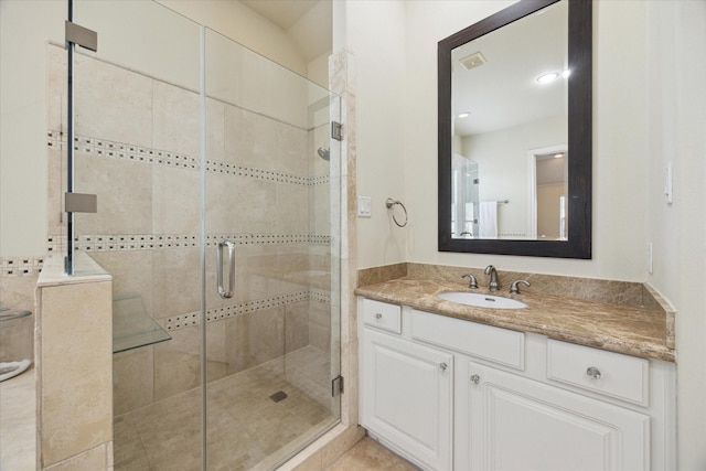 bathroom featuring vanity and walk in shower