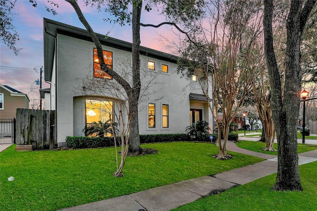 view of front of property with a yard