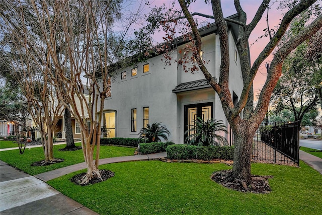 mediterranean / spanish-style home with a yard