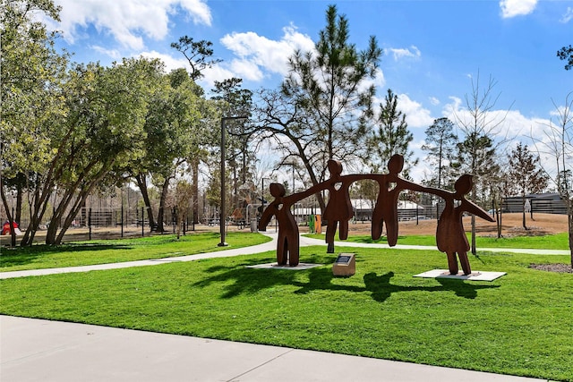 view of home's community with a lawn