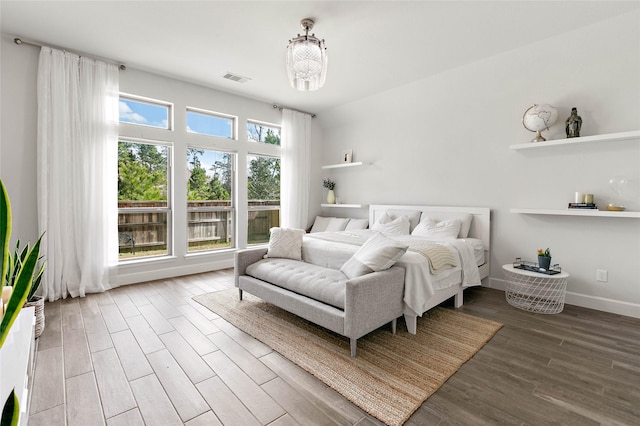 bedroom with wood-type flooring