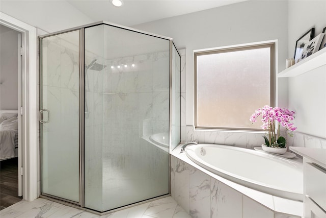 bathroom with vanity and independent shower and bath