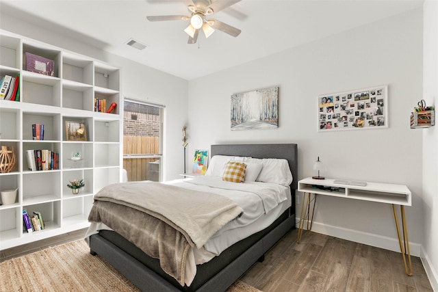 bedroom featuring ceiling fan and dark hardwood / wood-style flooring