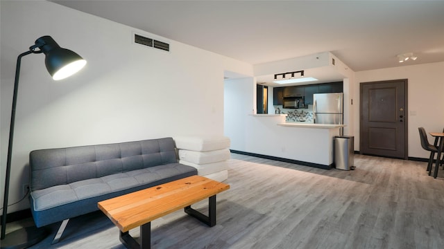 living area featuring hardwood / wood-style floors